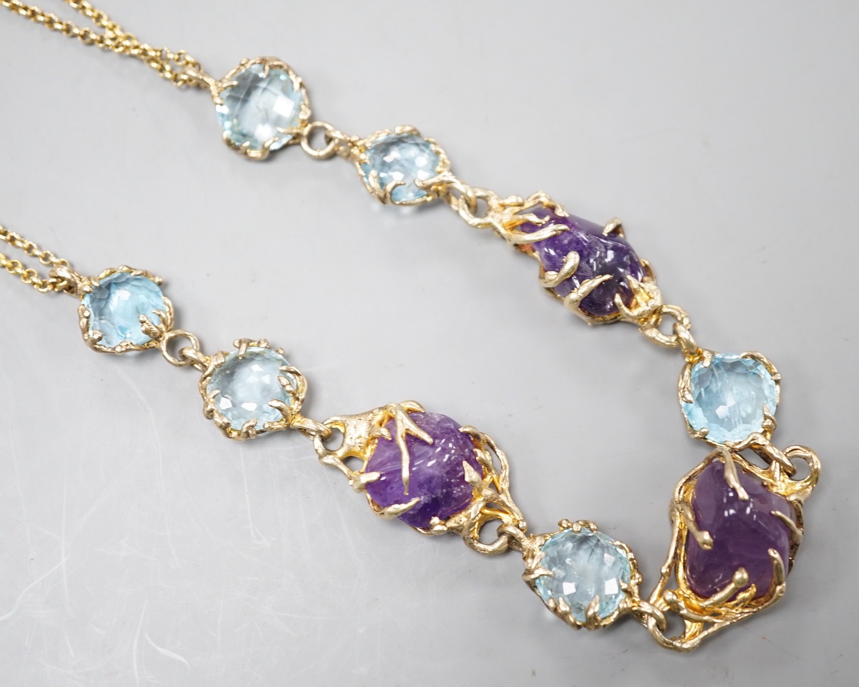 A gilt 925 amethyst pebble and gem set necklace, 42cm.